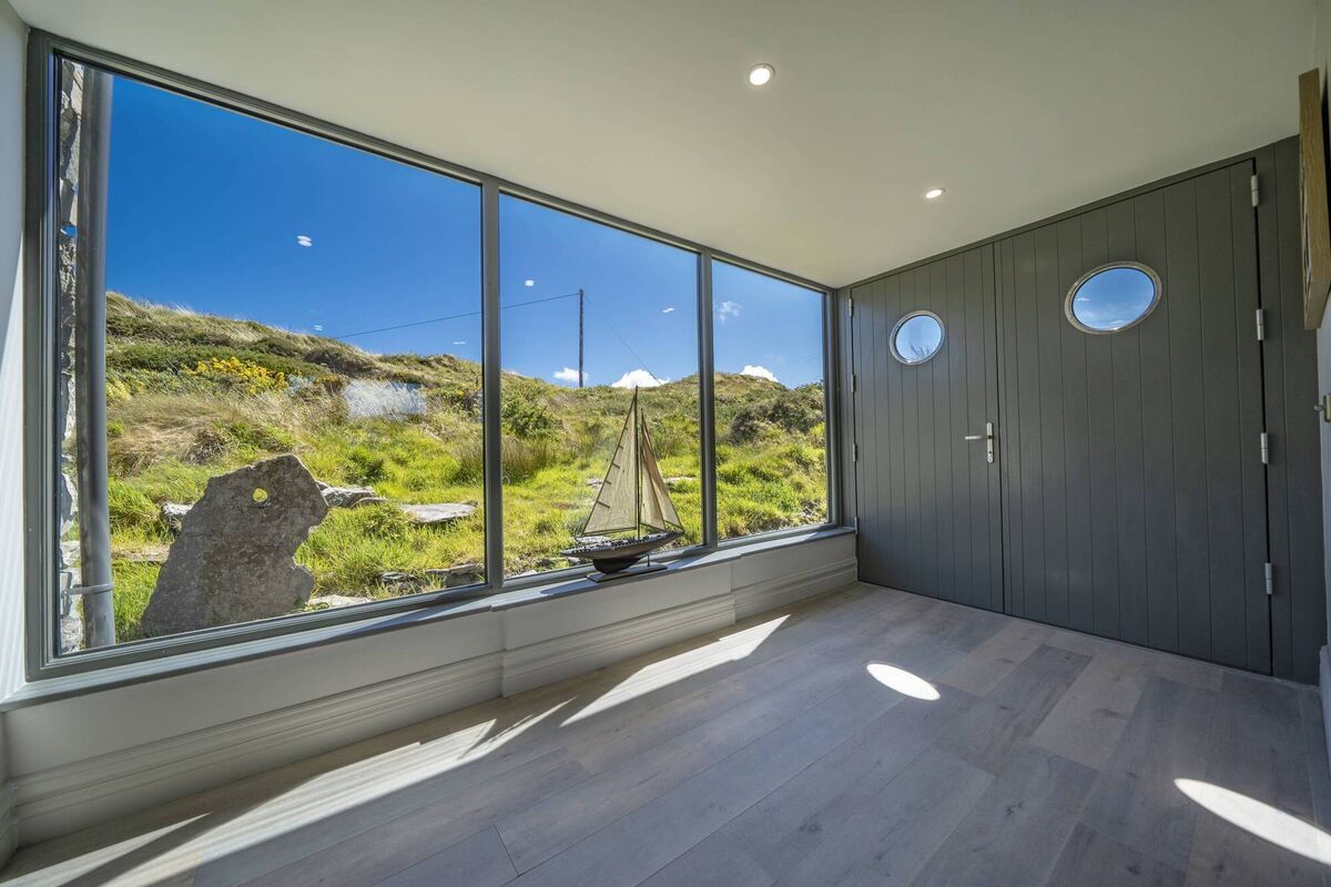 Porthole features on entrance double doors