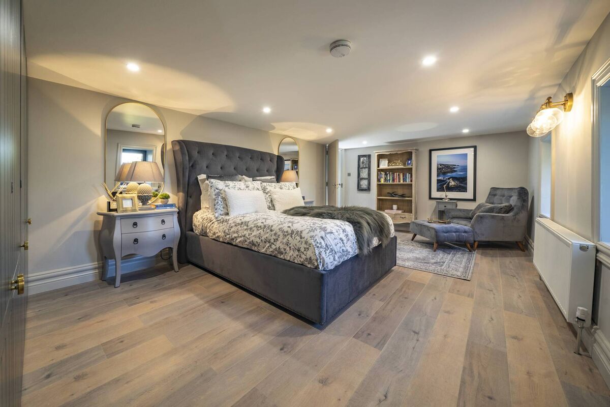 There are bedrooms on each of two levels, plus a one-bed guest apartment