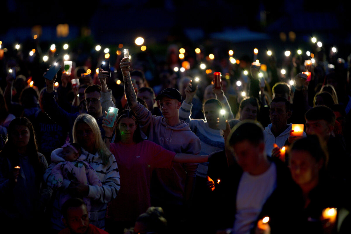 Members of the public attend a vigil for the victims of the Keyham mass shooting at North Down Crescent Park in Keyham, Plymouth 