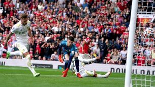<p>Leeds United goalkeeper Illan Meslier looks on as Manchester United's Bruno Fernandes scores their side's first goal at Old Trafford</p>