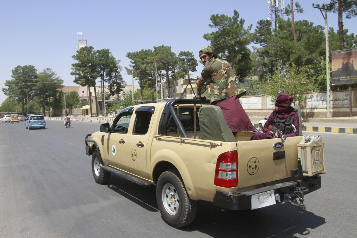Taliban fighters sit on the back of a vehicle in the city of Herat, west of Kabul, Afghanistan, Saturday, after they took this province from Afghan government. The Taliban seized two more provinces and approached the outskirts of Afghanistan’s capital. Picture: AP Photo/Hamed Sarfarazi Taliban fighters sit on the back of a vehicle in the city of Herat, west of Kabul, Afghanistan, Saturday, after they took this province from Afghan government. The Taliban seized two more provinces and approached the outskirts of Afghanistan’s capital. Picture: AP Photo/Hamed Sarfarazi