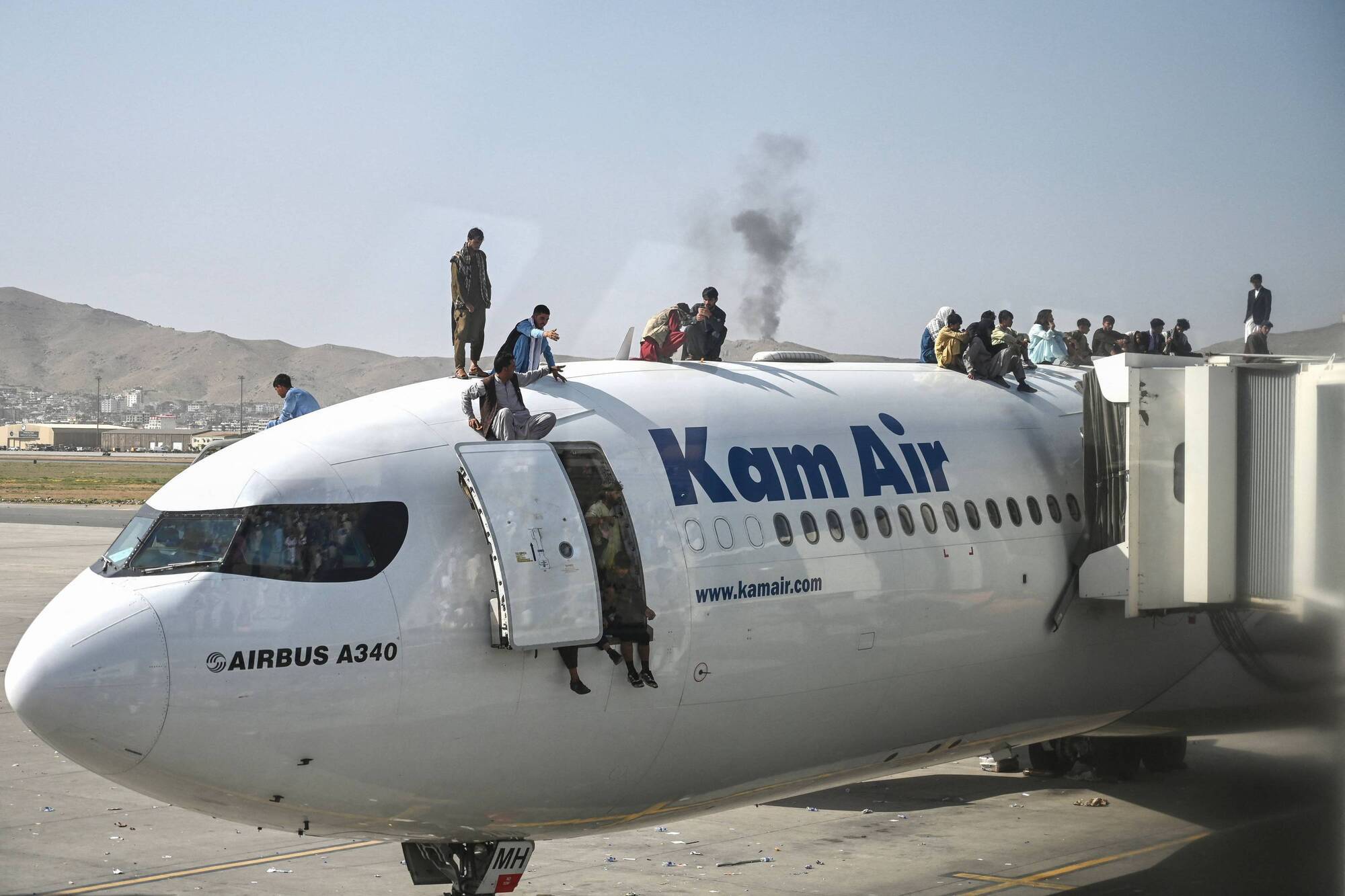 Footage appears to show Afghans falling from plane after take-off from Kabul Airport
