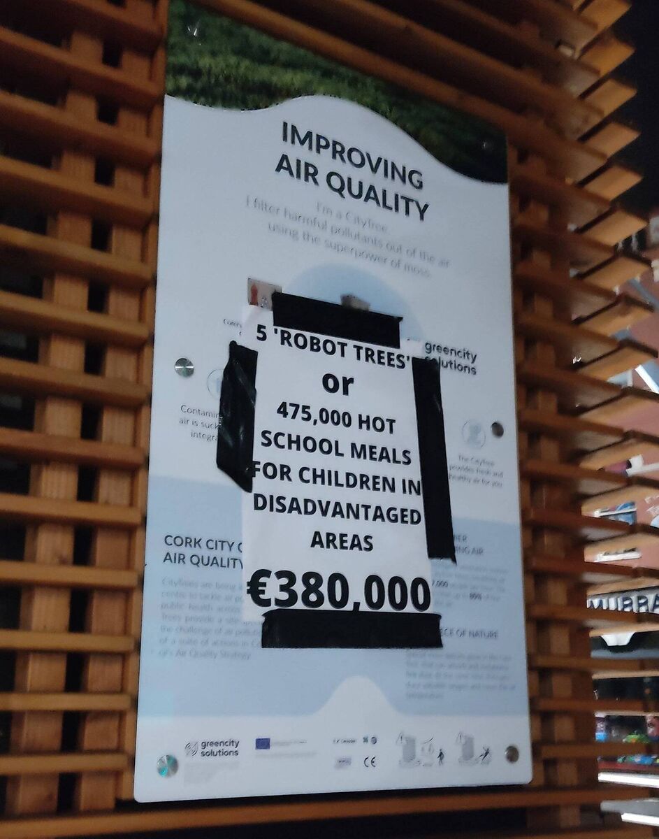 A posters attached to one of the robot trees in Cork, suggesting that the money spent on the machines could have paid for 475,000 school meals for children in disadvantaged areas.