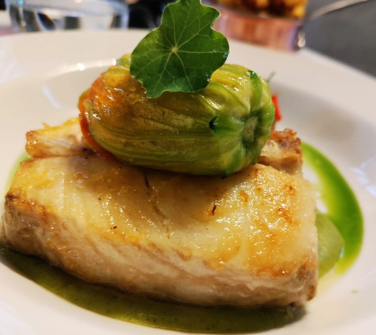 Halibut with stuffed courgette flower filled with prawn ceviche. Halibut with stuffed courgette flower filled with prawn ceviche.