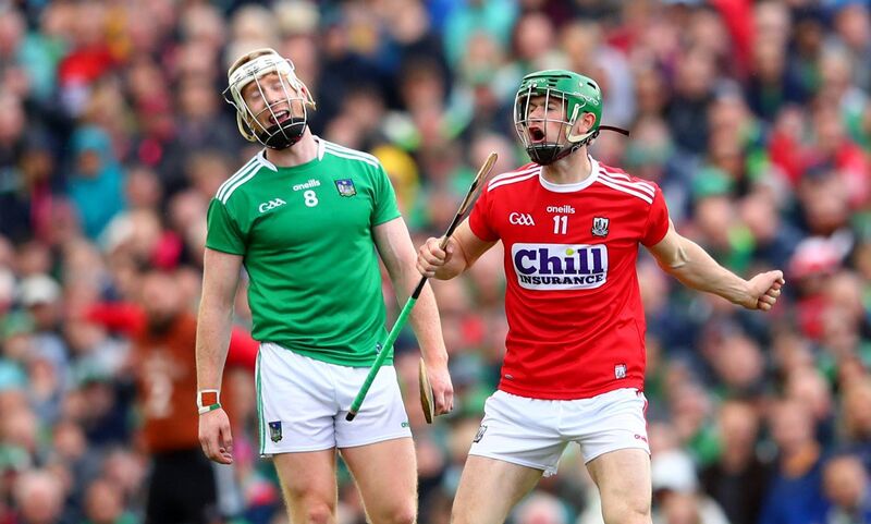 Limerick's Cian Lynch looks on dejected as Seamus Harnedy of Cork celebrates scoring a point during their 2019 win. Picture: INPHO/James Crombie