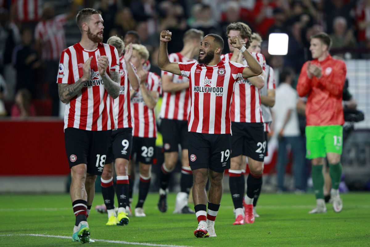 Brentford's Bryan Mbeumo, center, and Pontus Jansson, left, celebrate at the end of the English Premier League match against Arsenal. Picture: Ian Walton