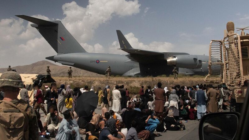 Refugees scramble to flee Afghanistan as the Taliban resume control. Picture: PA