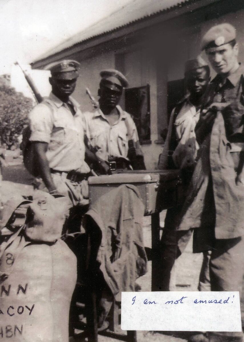 Tom Gunne with some of the enemy soldiers after the Jadotville siege.