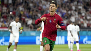 <p>Speculation in the final days of the transfer window won’t distract Portugal captain Cristiano Ronaldo from his intention of gorging Ireland in the pursuit of a record-breaking 110th international goal. (AP Photo/Darko Bandic, Pool)</p>