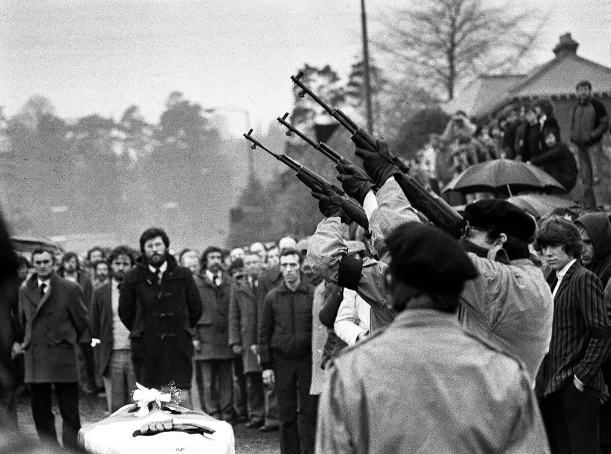 Three masked men fire volleys of rifle shots in 1981 over the coffin of hunger-striker Bobby Sands during a pause in the funeral procession to Belfast’s Milltown cemetery. Three masked men fire volleys of rifle shots in 1981 over the coffin of hunger-striker Bobby Sands during a pause in the funeral procession to Belfast’s Milltown cemetery.