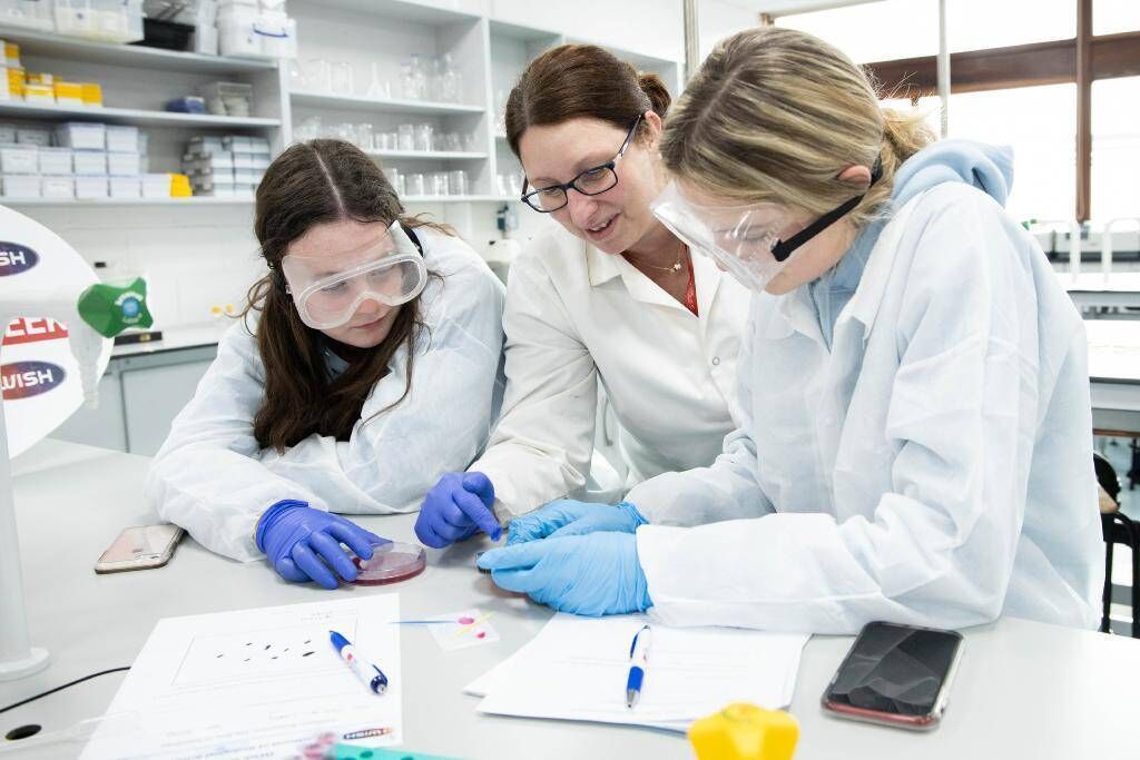 Secondary school students Grace McManus and Tara De Courcy with Dr Janette Walton, MTU, visiting a MTU science lab during the IWISH 2020 Campus Week (photo taken pre-Covid). Students regularly cite MTU’s connections with industry and communities as adding significant practical benefits as part of their studies. 