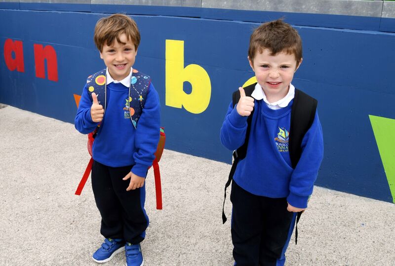 Éanna Ó Fátharta and Iarlaith Monaghan with a thumbs up on their first day in school. Picture: Denis Minihane. Éanna Ó Fátharta and Iarlaith Monaghan with a thumbs up on their first day in school. Picture: Denis Minihane.