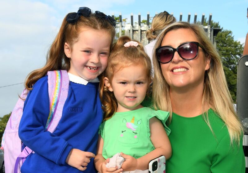 Liv Edmonds on her way back to school with her mother Amy and her sister Pippa. Picture: Denis Minihane. Liv Edmonds on her way back to school with her mother Amy and her sister Pippa. Picture: Denis Minihane.