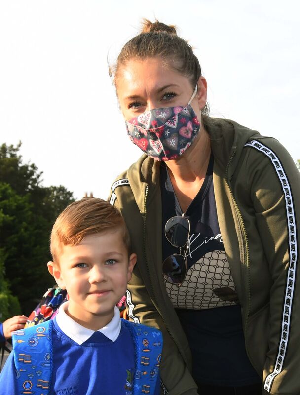 Oliver Biechonski with his mother Kamila as he arrived back to school. Picture: Denis Minihane Oliver Biechonski with his mother Kamila as he arrived back to school. Picture: Denis Minihane