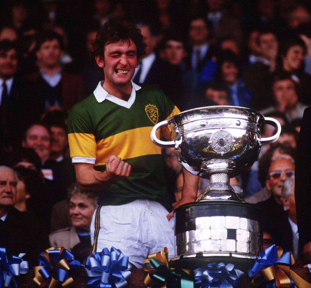 CENTENARY CAPTAIN: Kerry captain Ambrose O’Donovan about to lift the Sam Maguire Cup after victory over Dublin in 1984. O’Donovan is well known in Kerry now as a popular voice on radio. Picture: Ray McManus
                    