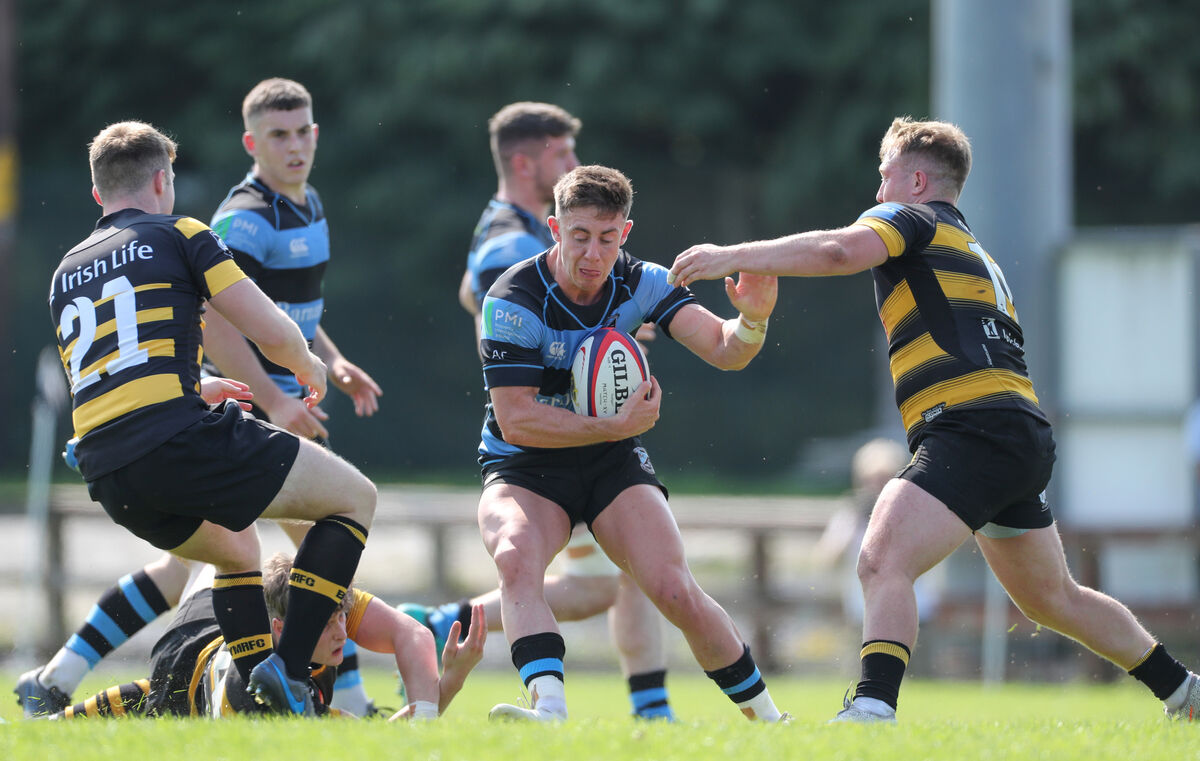 Jack O'Donnell of Shannon RFC with Jack Lyons and Luke Fitzgerald of Young Munster Jack O'Donnell of Shannon RFC with Jack Lyons and Luke Fitzgerald of Young Munster