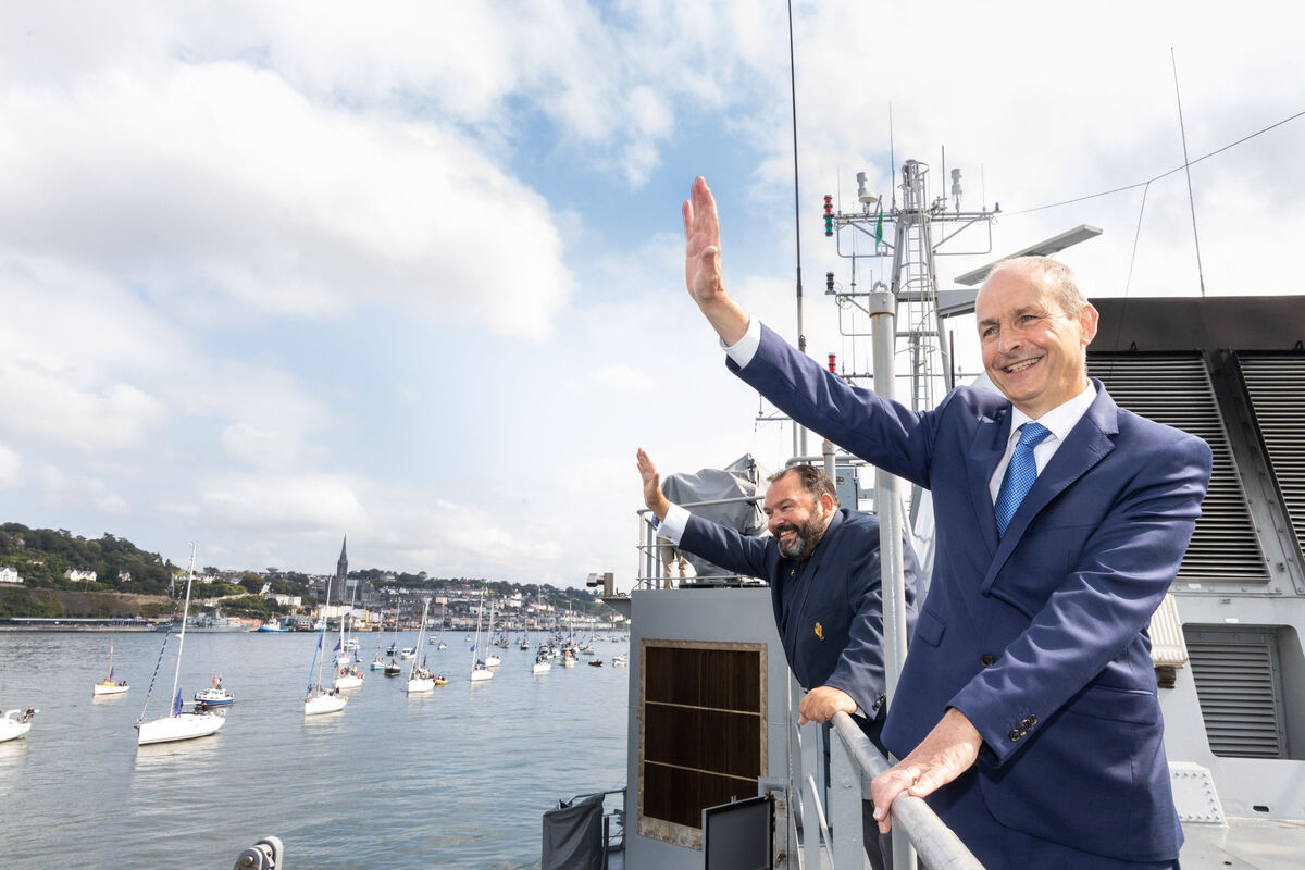 Taoiseach Micheál Martin and Colin Morehead, admiral of Royal Cork Yacht Club wave to sailors taking part in the tricentenary maritime parade. Picture: Darragh Kane Taoiseach Micheál Martin and Colin Morehead, admiral of Royal Cork Yacht Club wave to sailors taking part in the tricentenary maritime parade. Picture: Darragh Kane