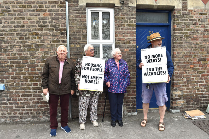 (Left to right) John O'Connell, Breda O'Connor, Breda Murray and Denis Fitzpatrick at the protest in Madden's Buildings today. "Old people here are living in dread. People can break into those empty houses." Picture: Dan Linehan