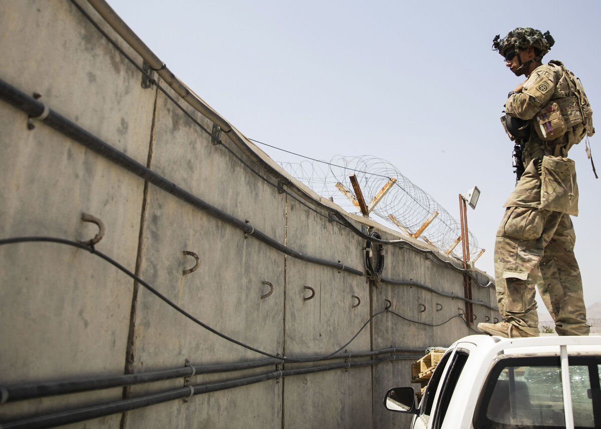 A paratrooper conducts security at Hamid Karzai International Airport in Kabul
