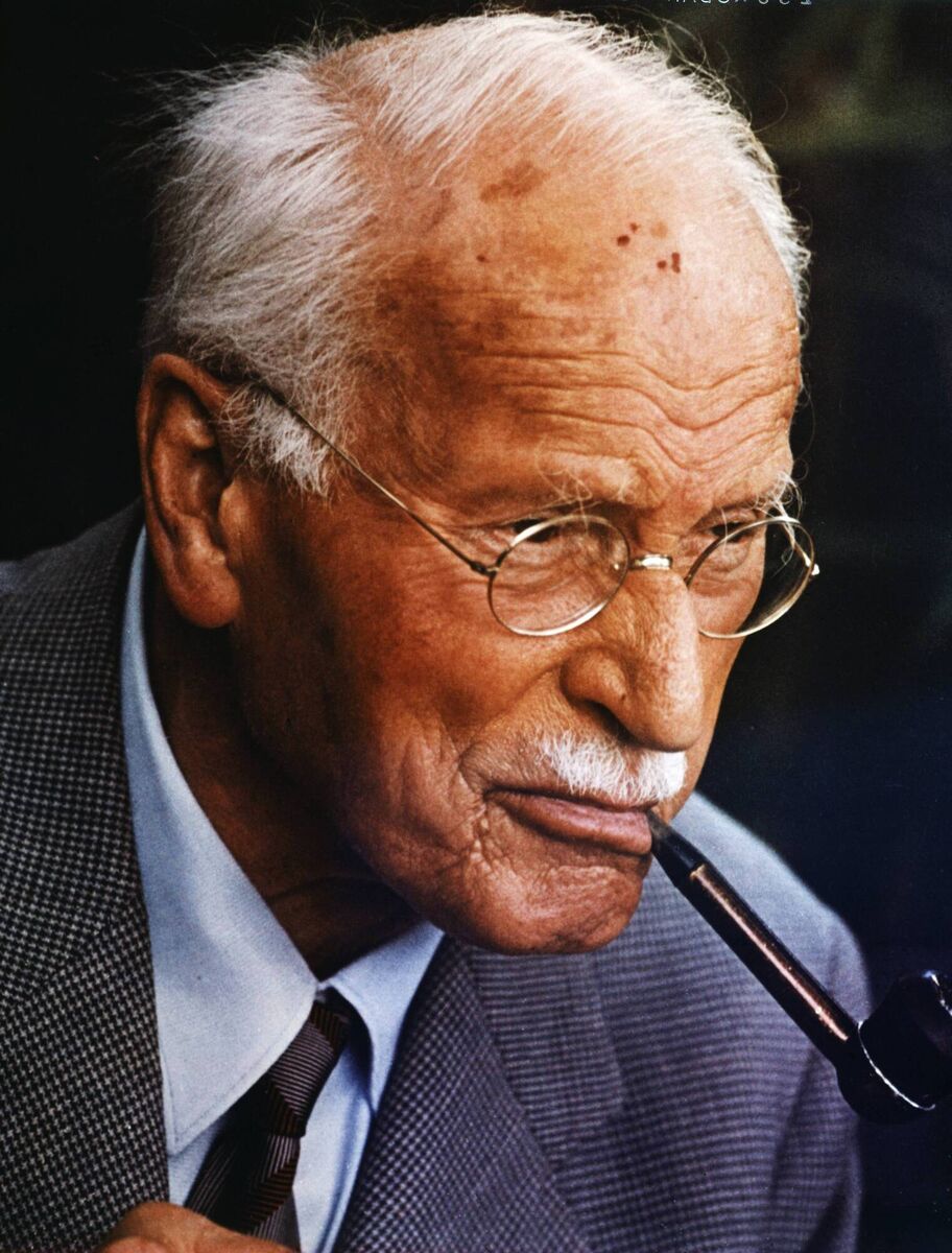 Swiss psychiatrist Carl Gustav Jung (1875-1961) smoking a pipe. He is known as the founder of analytical psychology.