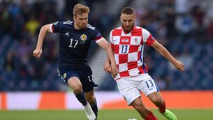 <p>Croatia's midfielder Nikola Vlasic (R) is marked by Scotland's midfielder Stuart Armstrong during EURO 2020.</p>