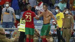 <p>Portugal's Cristiano Ronaldo, right, celebrates after scoring his side's second goal. Picture: AP Photo/Armando Franca</p>