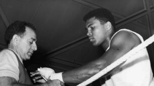 <p>
                <span class="contextmenu emphasis textWhite">Muhammad Ali has his hands bandaged by manager Angelo Dundee before a bout of sparring at the Royal Artillery gym, London in 1966 ahead of his meeting with Henry Cooper. </span>Picture: George Freston/Fox Photos/Hulton Archive/Getty</p>