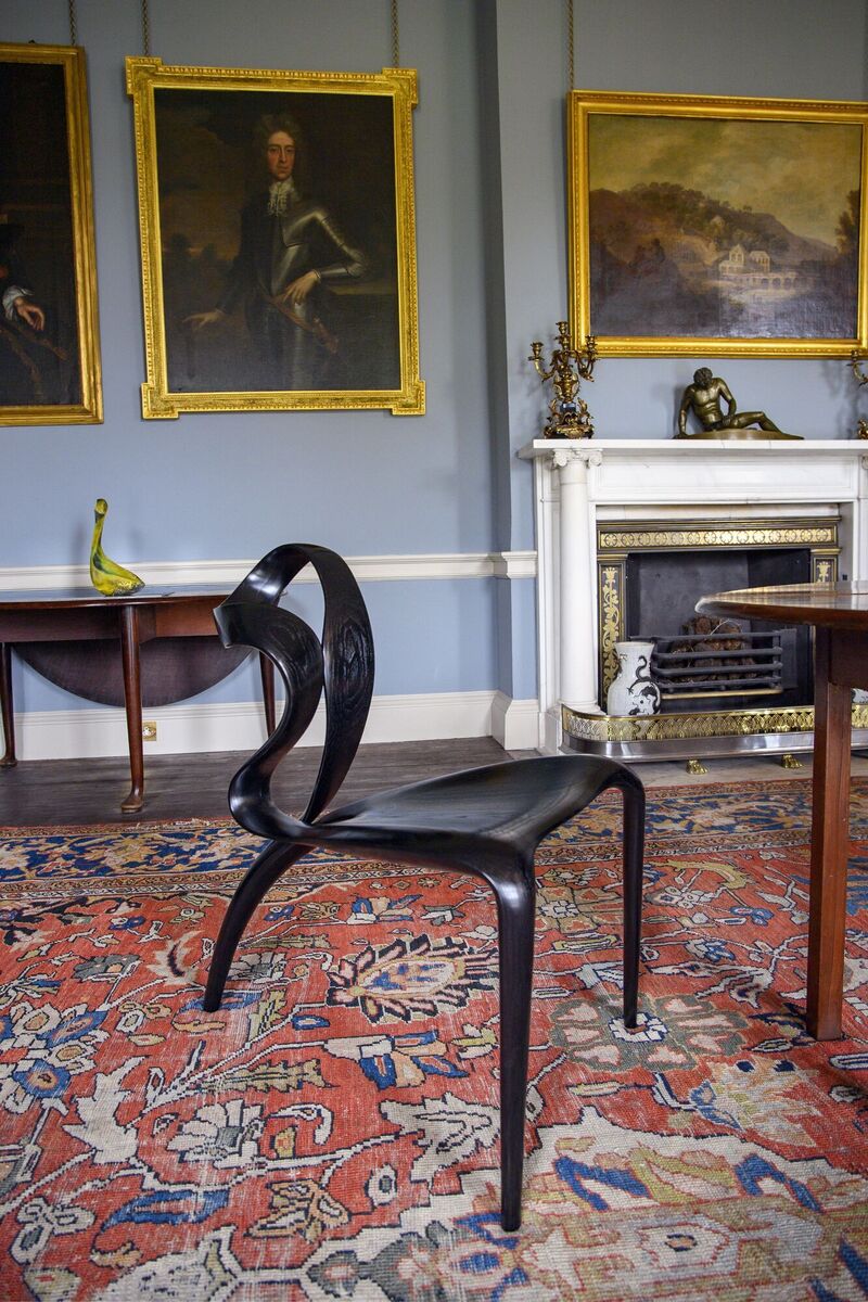 Four of Joseph Walsh’s Enignum II Locus chairs made from ebonsied ash surround the house’s antique dining table. Four of Joseph Walsh’s Enignum II Locus chairs made from ebonsied ash surround the house’s antique dining table.