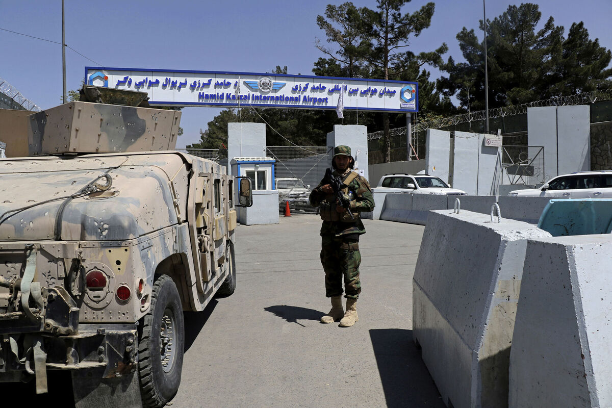 A Taliban soldier stands guard at the gate of Hamid Karzai International Airport in Kabul, Afghanistan, Sunday, Sept. 5, 2021. Some domestic flights have resumed at Kabul's airport, with the state-run Ariana Afghan Airlines operating flights to three provinces. (AP Photo/Wali Sabawoon) A Taliban soldier stands guard at the gate of Hamid Karzai International Airport in Kabul, Afghanistan, Sunday, Sept. 5, 2021. Some domestic flights have resumed at Kabul's airport, with the state-run Ariana Afghan Airlines operating flights to three provinces. (AP Photo/Wali Sabawoon)