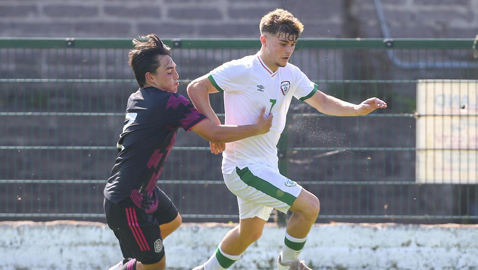 Kevin Zefi holds off Mexico's Gael Delgado in the U17 international friendly at Turner's Cross today. Picture: Inpho/Ken Sutton