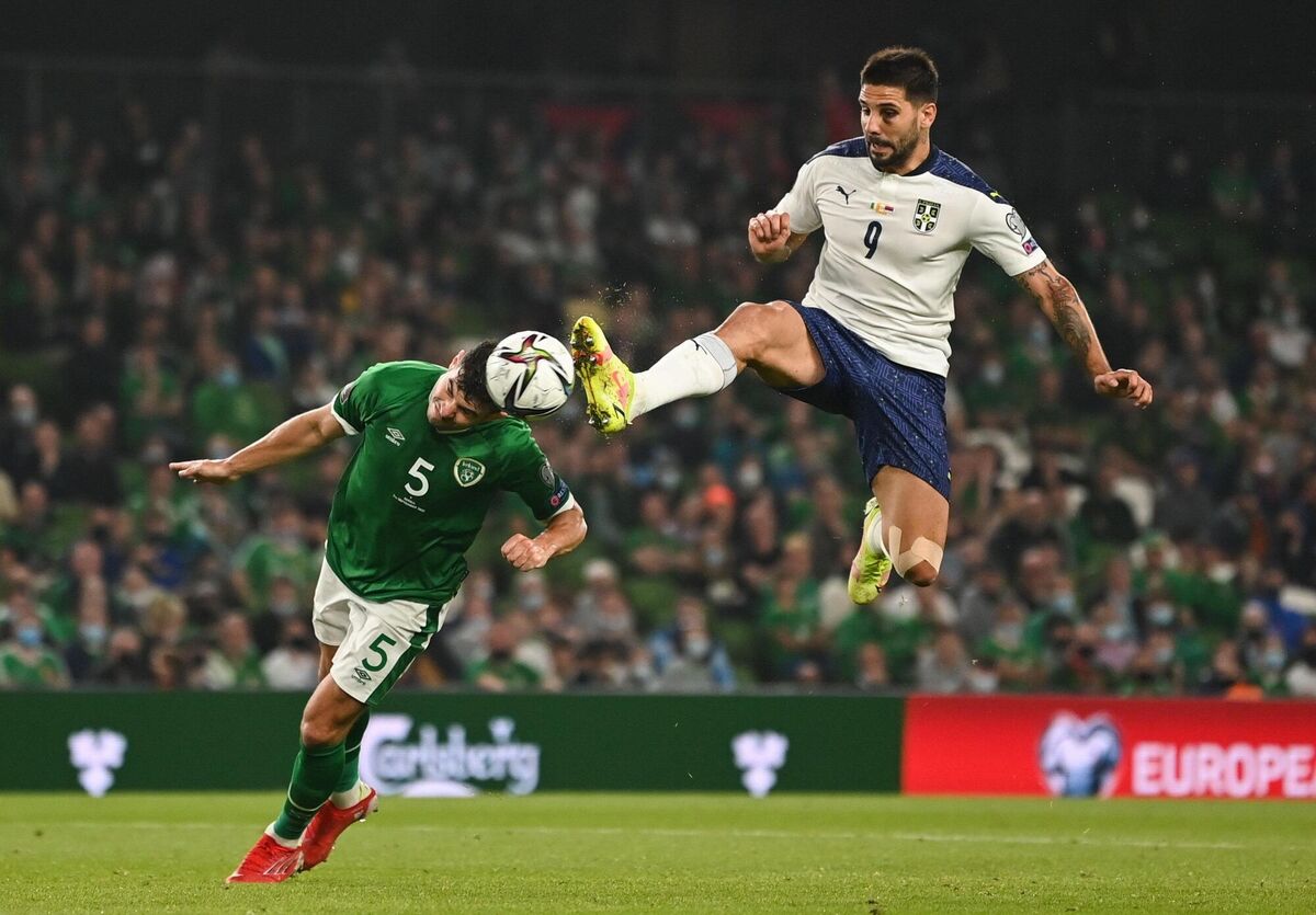 Ireland's John Egan in action against Aleksandar Mitrovic of Serbia. Photo by Harry Murphy/Sportsfile
