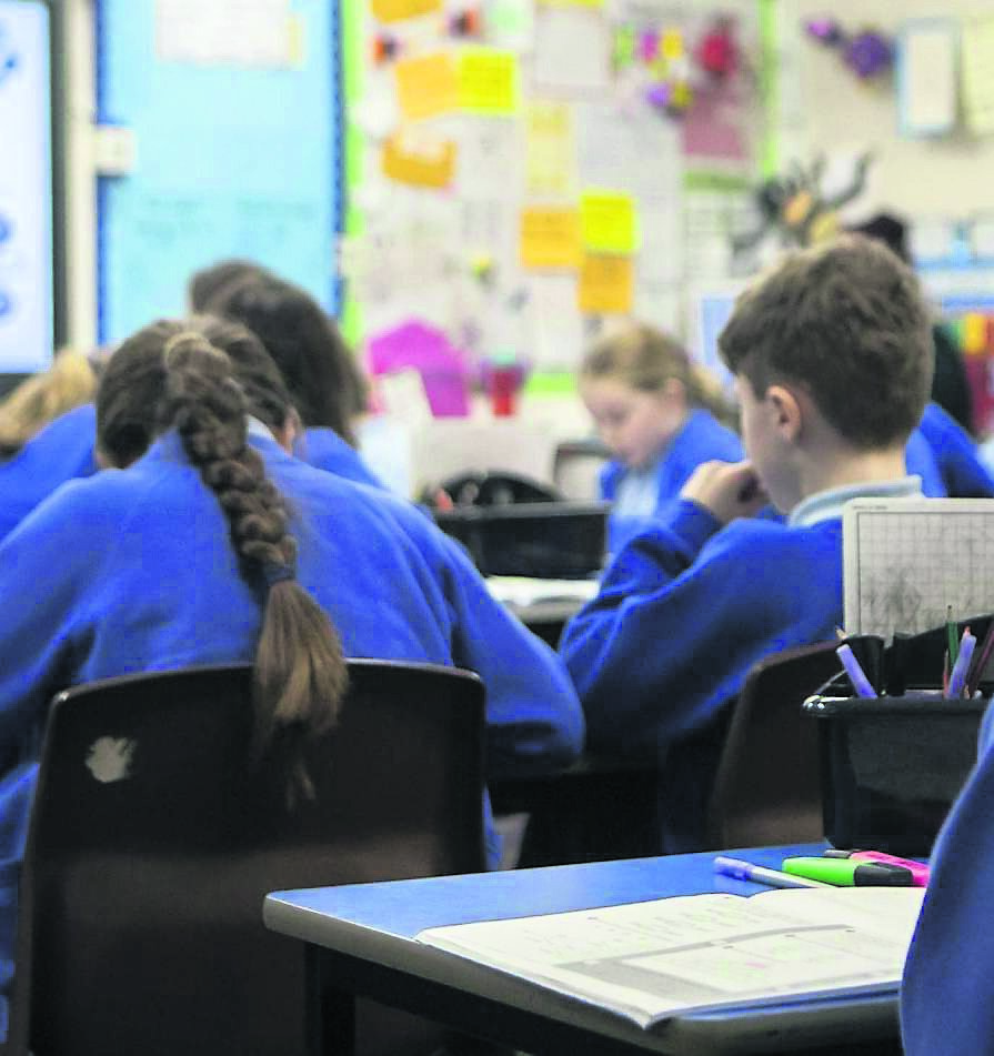 Confusion over symptoms to blame for pupils with Covid attending school, says union