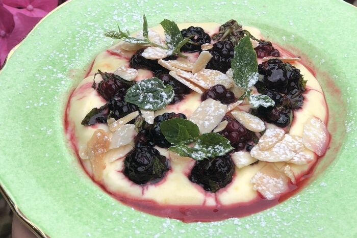 Lemon curd cream with blackberries and toasted almonds
