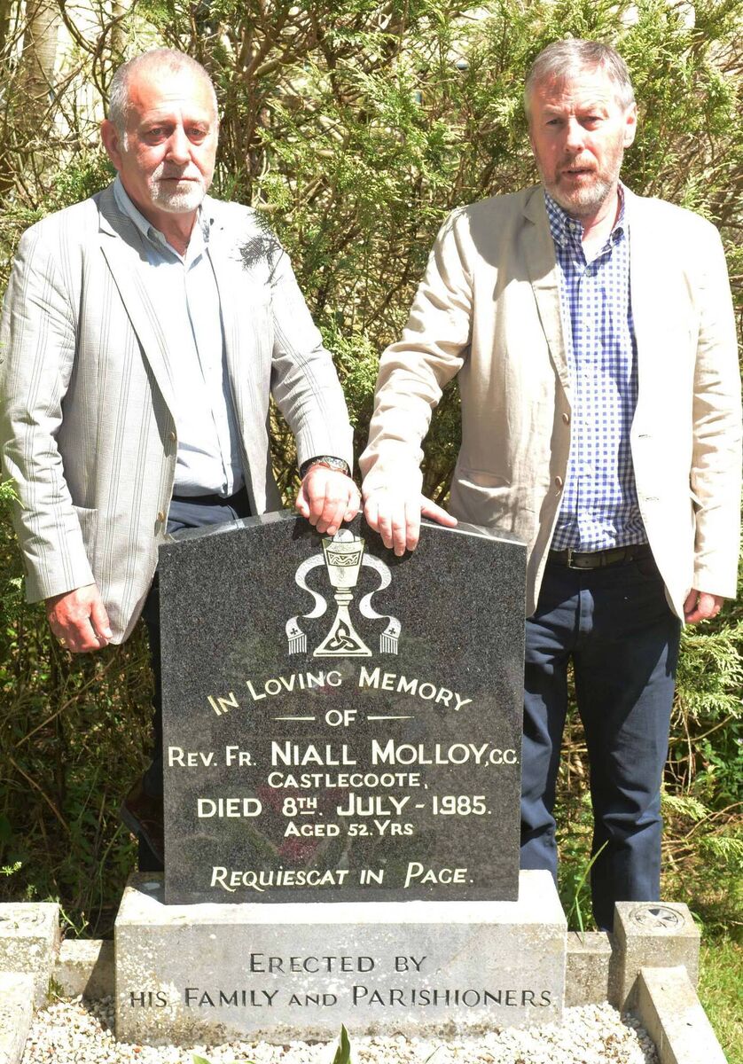 Henry McCourt and Bill Maher at the gravestone of their uncle Fr Niall Molloy in Castlecoote in 2018.
