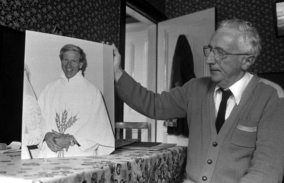  Fr Niall Molloy’s brother, Billy, at his home with a photograph of Niall. Picture: Eamonn Farrell/RollingNews.ie