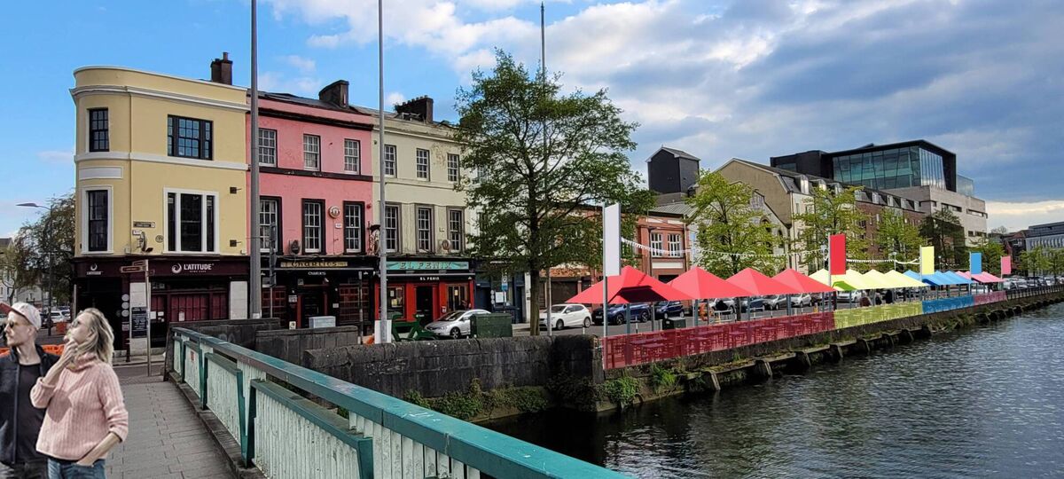 
                        Union Quay: Festoon light and 16 parasols will be installed, similar to those on Princes Street, with each premises having a unique colour and windbreaker. Improved pedestrian and wheelchair accessive as well as an improved resurfaced road surface will also be included. Picture: Meitheal Architects
