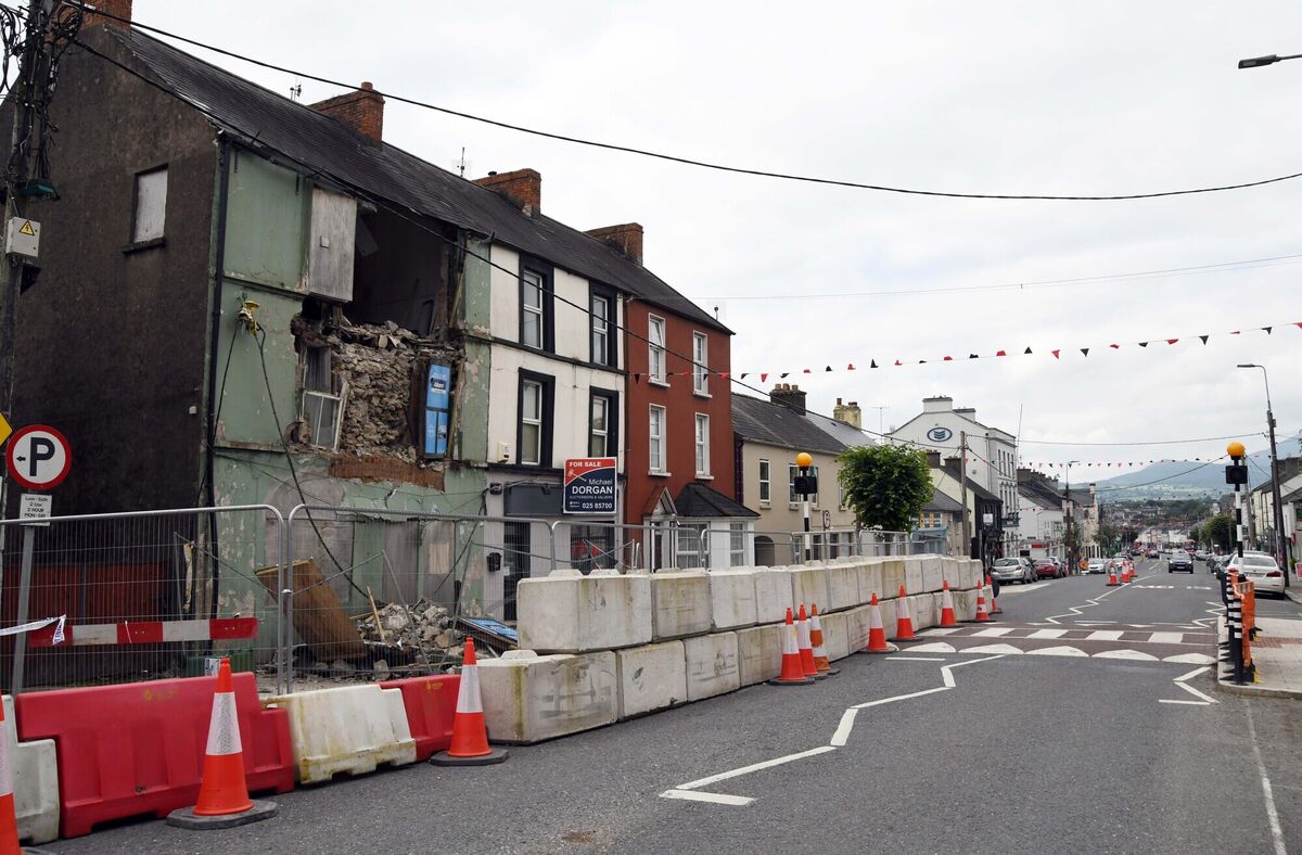 (Left) A derelict building, part of which collapsed recently on Upper Cork Street, Mitchelstown, Co. Cork. With a construction sector at full capacity, the question arises - who exactly is going to undertake the work of restoring these buildings? Picture: Denis Minihane