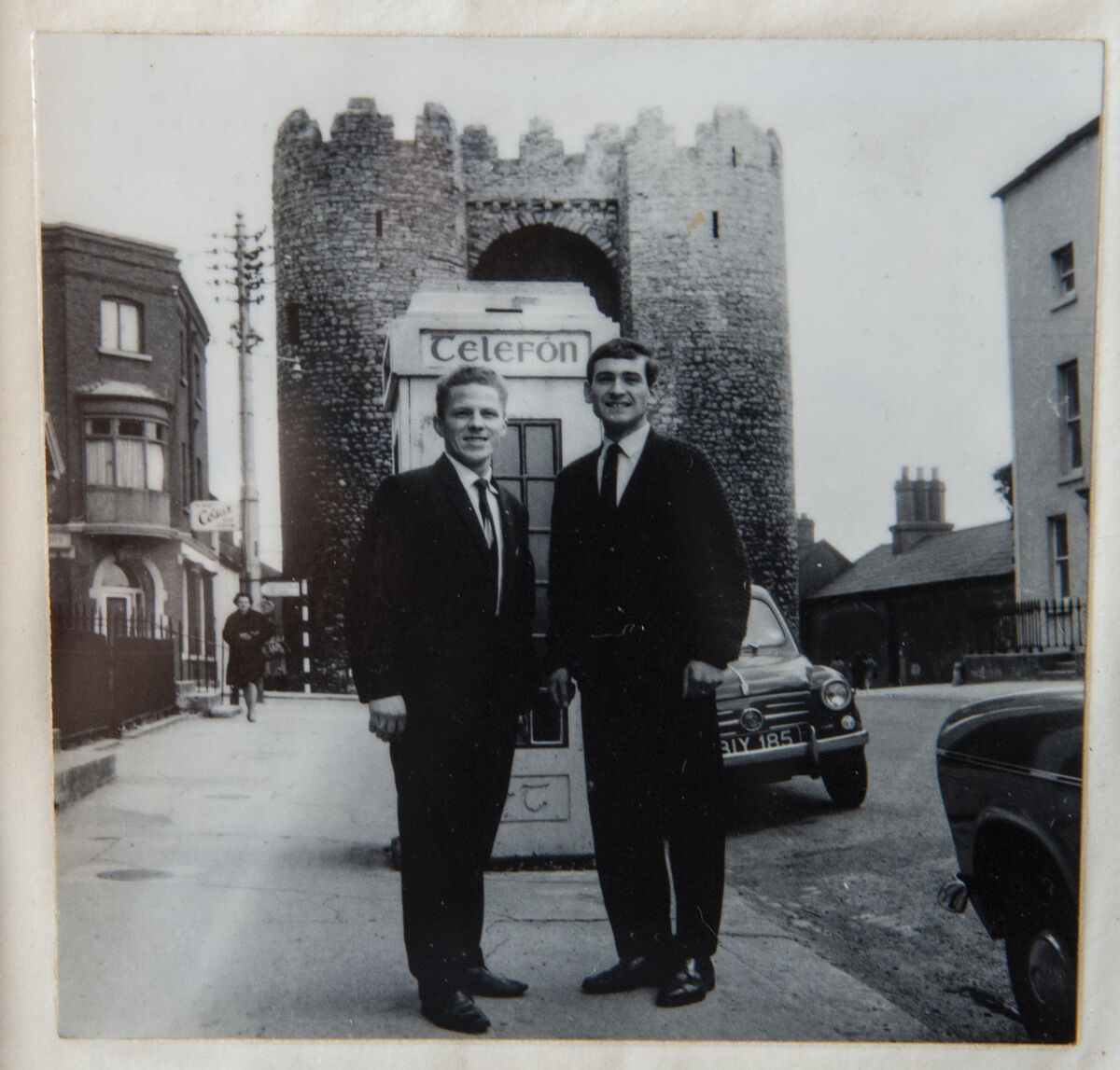 Paul (right) and Pat pictured at the phone box where they found baby John in 1965. Paul believes that but for the cries, the baby would not have made it through the night.
