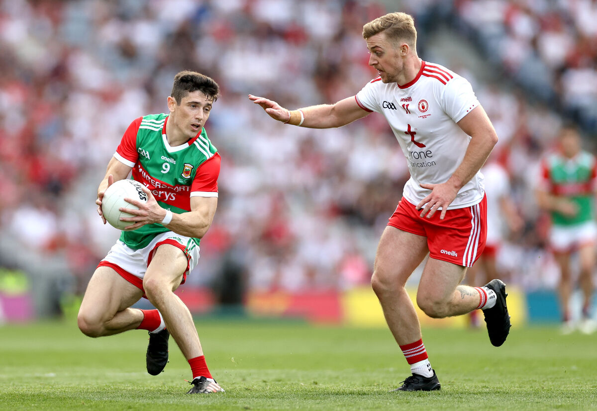 Mayo’s Conor Loftus and Michael O'Neill of Tyrone. Picture: INPHO/James Crombie