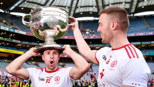 <p>Tyrone's Conor McKenna and Brian Kennedy celebrate with the Sam Maguire. Picture: INPHO/Tommy Dickson</p>