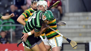 <p>Douglas defender Eoin Cadogan is tackled by Glen Rover's Patrick Horgan. Picture: Eddie O'Hare</p>