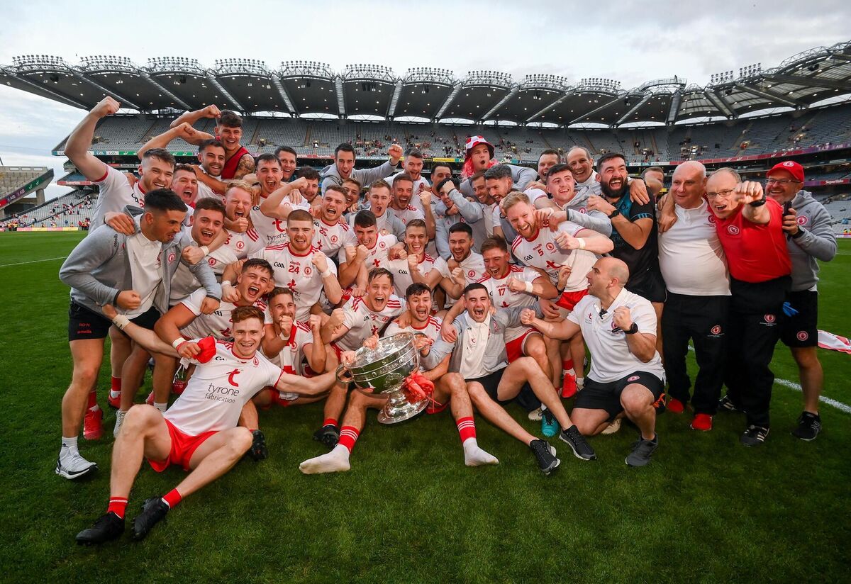 Tyrone players and staff celebrate with the Sam Maguire Cup following the win. Picture: Stephen McCarthy/Sportsfile