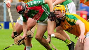 <p>James Hammersley of Clonoulty Rossmore and Toomevara's Liam Ryan fight for possession. Photo by Eamonn McGee</p>