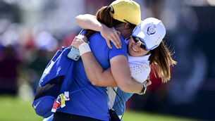 <p>Europe's Leona Maguire celebrates with her sister Lisa after defeating United States' Jennifer Kupcho on the 15th hole during the singles matches at the Solheim Cup. Picture: AP Photo/David Dermer</p>