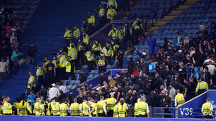 <p>Stewards and police form a wall separating Leicester City and Napoli fans after the UEFA Europa League match at the King Power Stadium. Picture: Mike Egerton/PA </p>