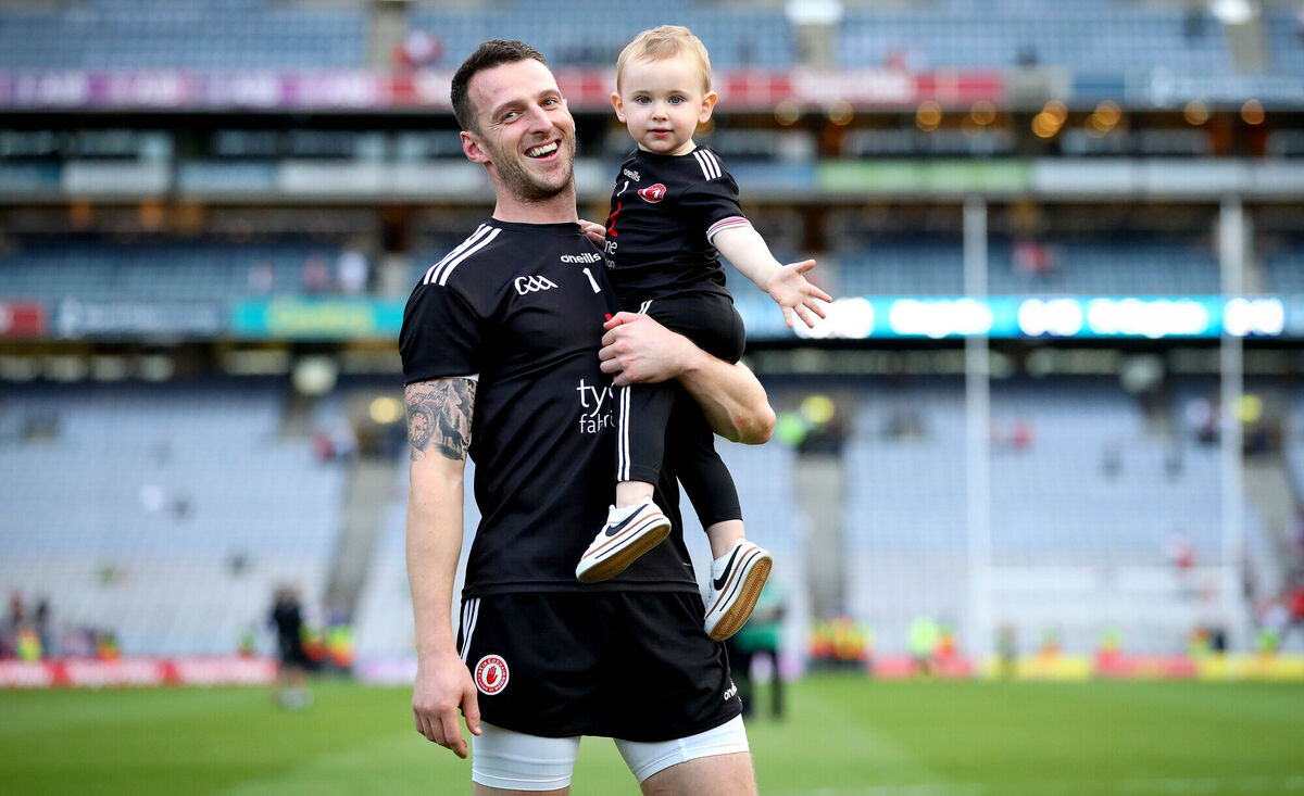 Tyrone goalkeeper Niall Morgan celebrate with his son Criostai. Picture: INPHO/Ryan Byrne
