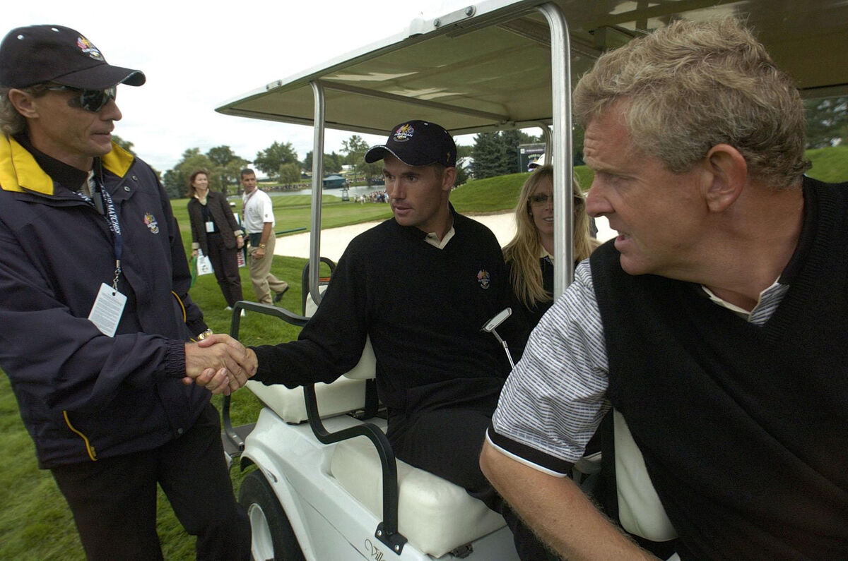 Captain Bernhard Langer shakes hands with Pádraig Harrington, with Colin Montgomerie at Oakland Hills in 2004. Harrington’s instinct is to emulate the efficient management style of Langer at that Ryder Cup.
