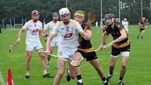 <p>Fermoy's Kieran Morrison and Brian O'Sullivan chase down Bandon' Rory Fogarty. Picture: Jim Coughlan.                                            </p>