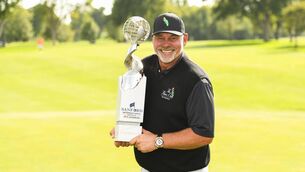 <p>Darren Clarke poses for photos after winning the Sanford International at Sioux Falls, South Dakota. </p>