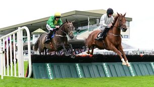 <p>Farout and Brian Hayes (left) win the Guinness Novice Hurdle from Carrarea (right) in July. Picture: Healy Racing.</p>